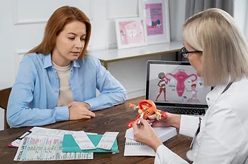 Doctor counseling a woman about gynecology services