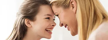 Happy mother and daughter receiving gynecology services at Feto Maternal & GenetYX Center